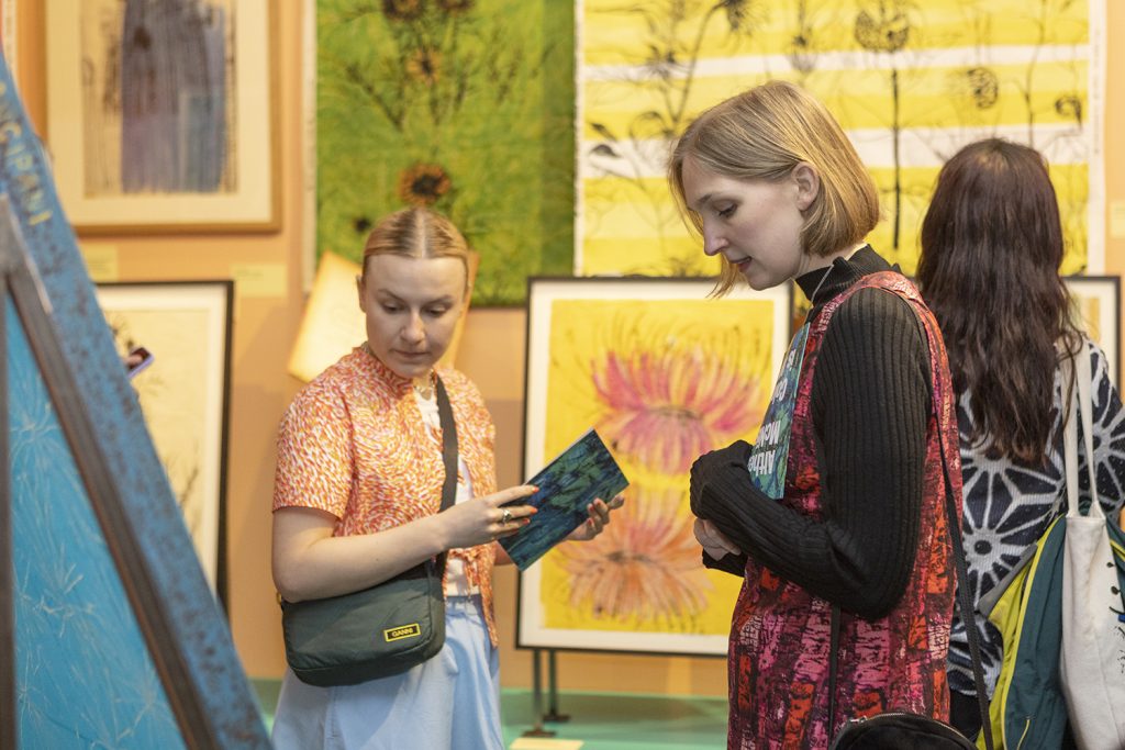Visitors to an exhibition discussing the displays