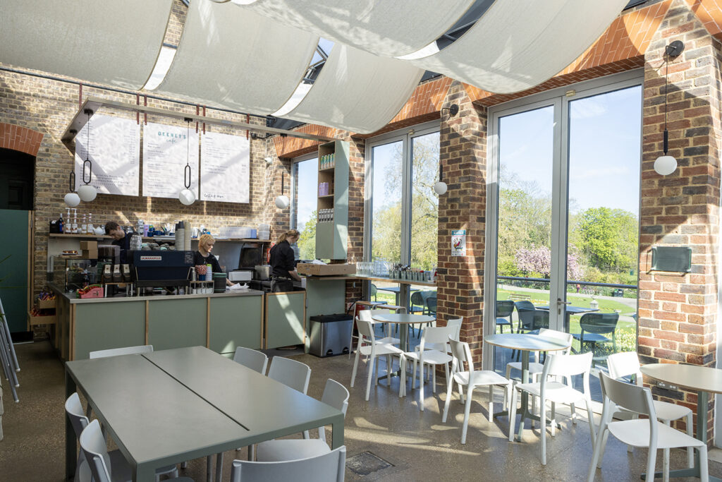 Image of the Cafe at William Morris Gallery. Sun is shining into the cafe through the ceiling glass and windows