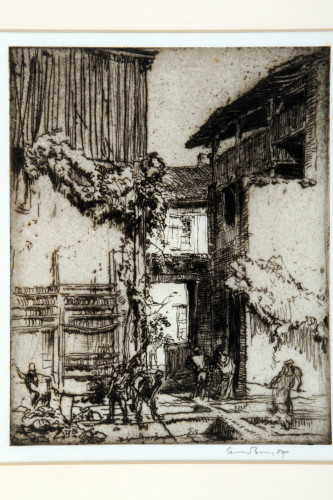 Tannery men work on hides spread in the courtyard, tall buildings with gateway between beyond