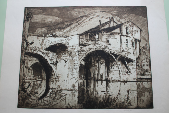 Image of an old arched bridge with mill, boat with figure foreground left, houses on far bank right with hills beyond