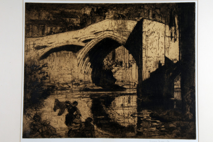 Bridge over river with female figures in foreground