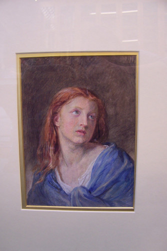 Girl with red hair and blue cloak