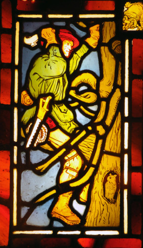 Stained glass panel of a woodcutter