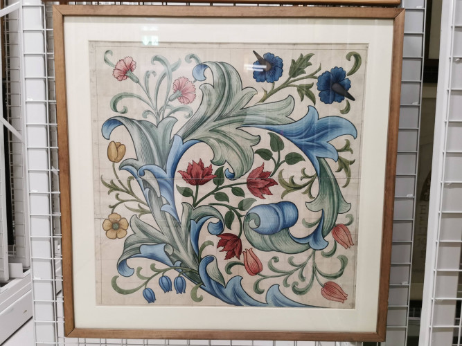 Colourful design showing swirling acanthus leaf with a variety of flowers