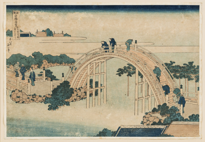 high semi circular bridge with people crossing