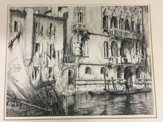 Venetian houses on a canal with barge