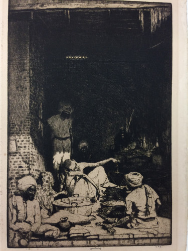 men seated on floor at entrance shop