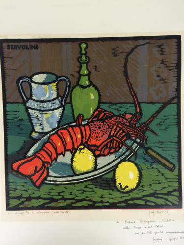 crayfish on a plate with lemons, bottle and glass on table
