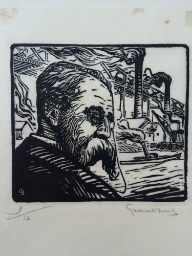 man with moustache in front of industrial scene