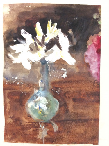 white flower in blue vase on brown table