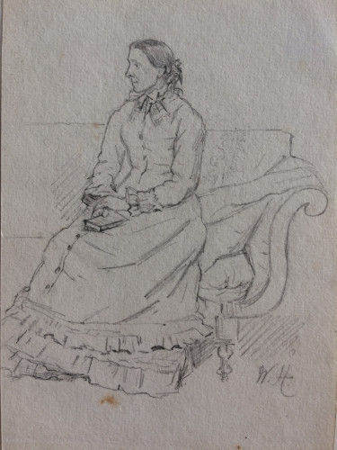 woman seated on sofa in frilly dress, hands on lap