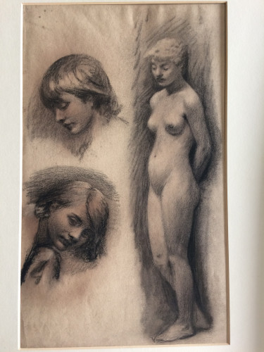 two sketches of faces and a third nude child standing