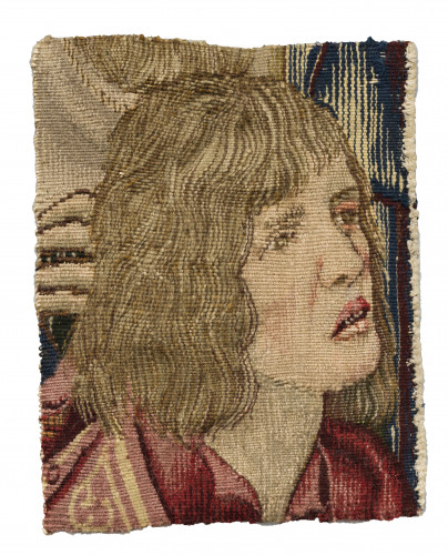 A small weaving showing the head of a man with shoulder length fair hair