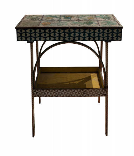 A heavily decorated table painted with patterns and flowers