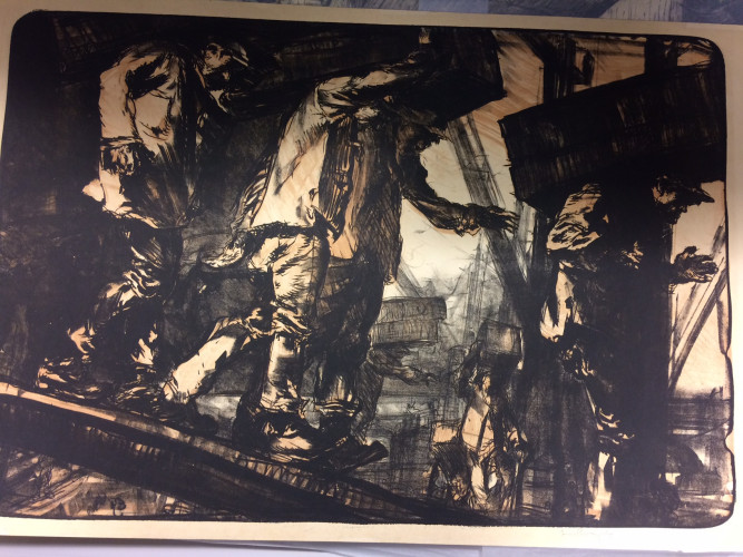 men carrying boxes walking down a slope