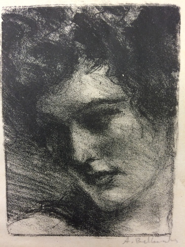 head and schoulders portrait of woman looking to left and down