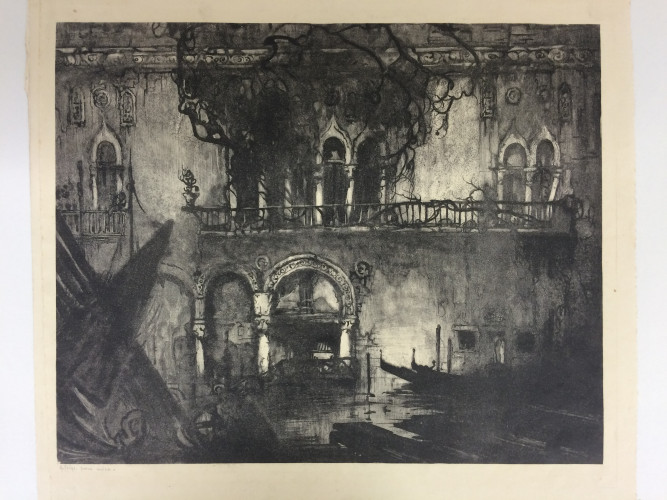 houses on waterfront with boats and arch