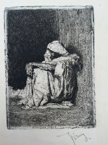 cloaked figure seated in doorway