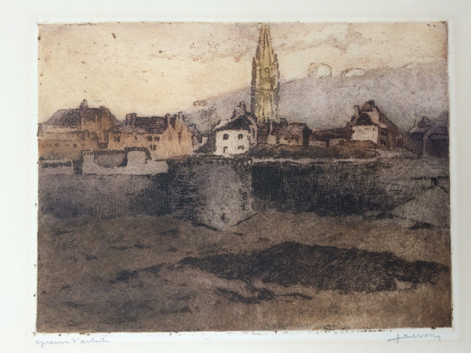 town with church tower seen from riverbank