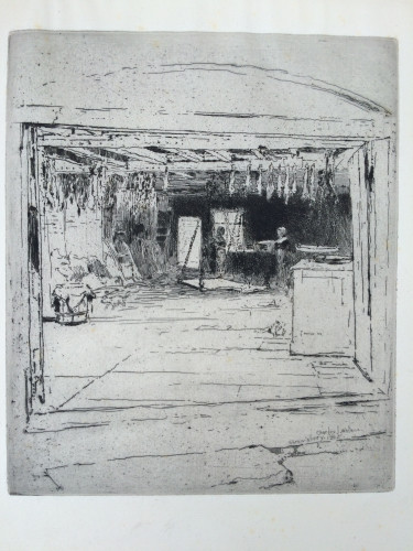 large room with few furnishings and items hanging from the beams, two women standing in the back