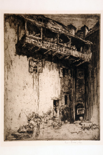 People dwarfed by a tall house with a single window below a long wooden gallery above