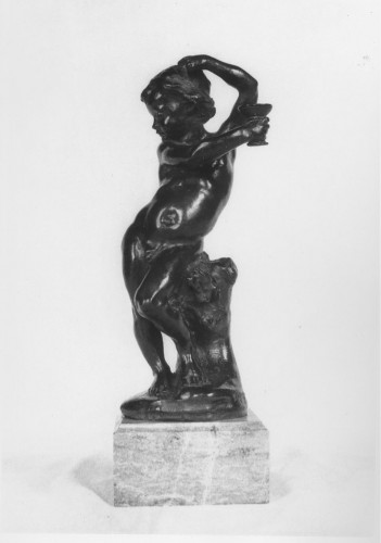 Nude standing boy in contrapposto pose, his right leg relaxed his hip leaning against a tree stump. He looks to the left, his right hand raised to his head, the left arm extended across his body and holding a stem goblet. Front view.