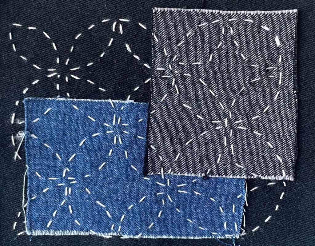 Sashiko embroidery in a circular pattern (Japanese technique) joining 3 pieces of material together (3 shades of blue fabric)