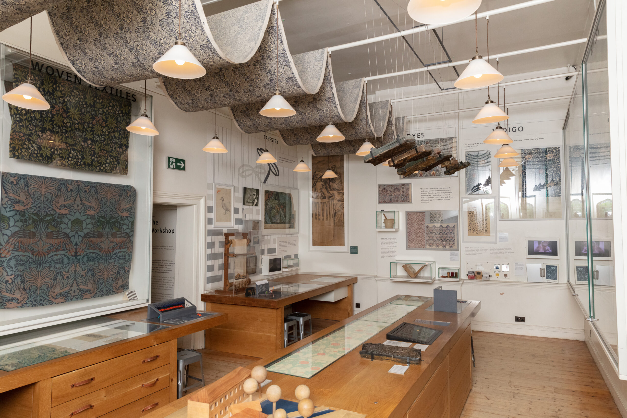 Inside an exhibition room at the gallery showing the print process