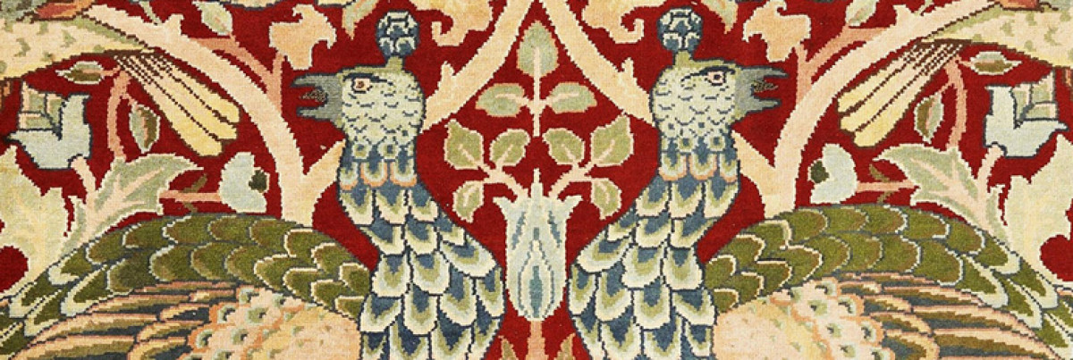 Peacocks on a carpet facing away from each other on a decorative background